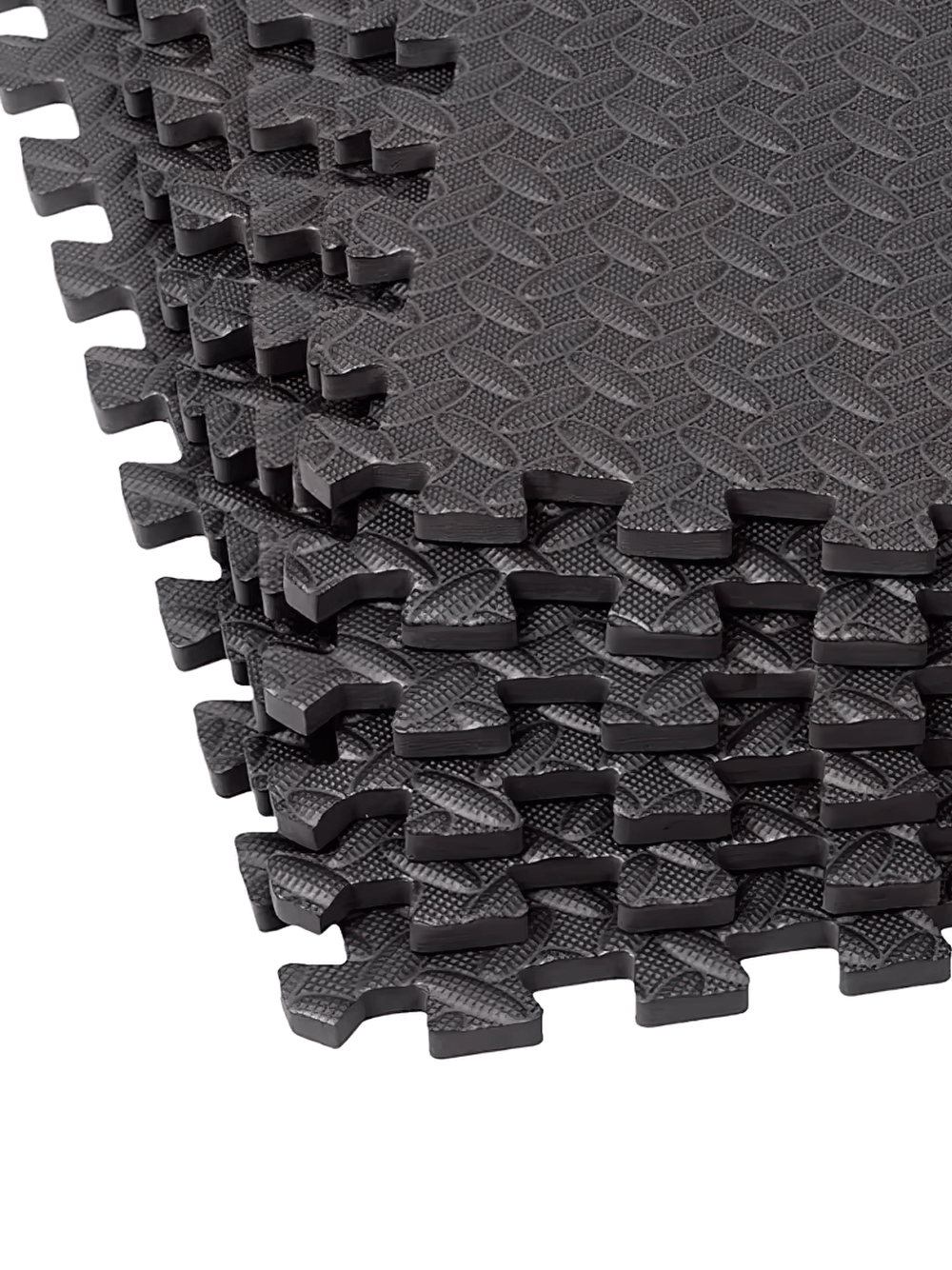 Stack of high-density black interlocking EVA foam mats, perfect for home gyms and exercise areas. Durable, non-slip surface for yoga.